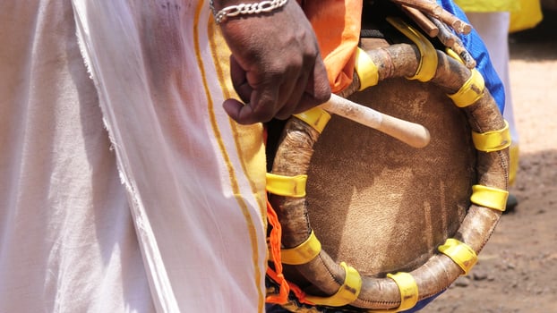 An artist playing Thavil, a South Indian traditional musical instrument photo