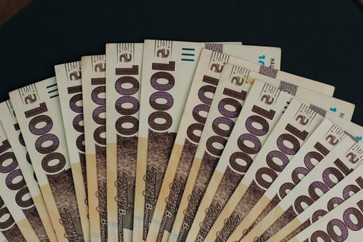 Banknote of 1000 Ukrainian hryvnias on a denim background in a pocket photo