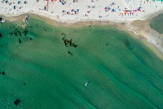 zenithal aerial view of a beach with people enjoying the summer photo