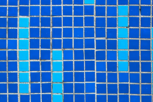 Texture of blue mosaic tiles, close-up photo