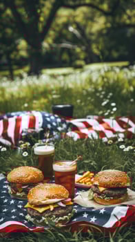 Delicious Burgers and Drinks on American Flag Picnic Blanket photo