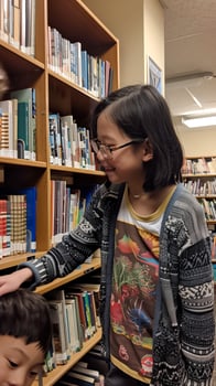 Children exploring books in a cozy library, smiling and learning photo
