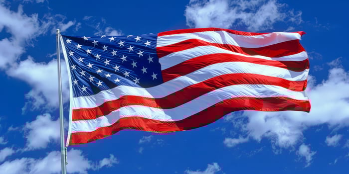Close-Up of American Flag with People in Background photo