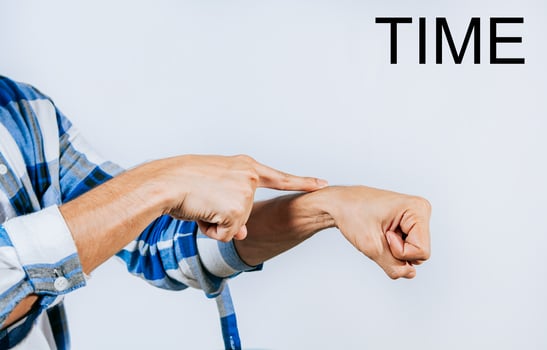 Person hand making TIME ASL American sign language. Hand making TIME gesture in sign language isolated photo