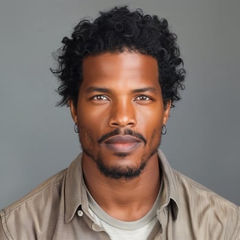 Confident African American Man With Curly Hair on Solid Background photo