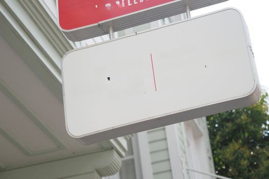 Street signboard mockup on modern city building photo