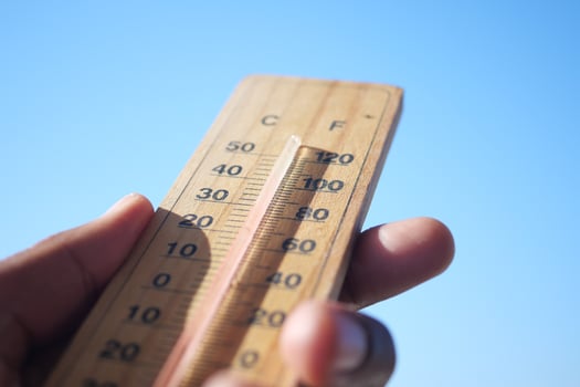 Thermometer that is effectively measuring the temperature in a clear blue sky during daytime photo