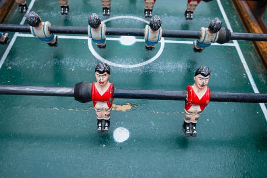selective focus, detail of the metal players on a soccer table photo