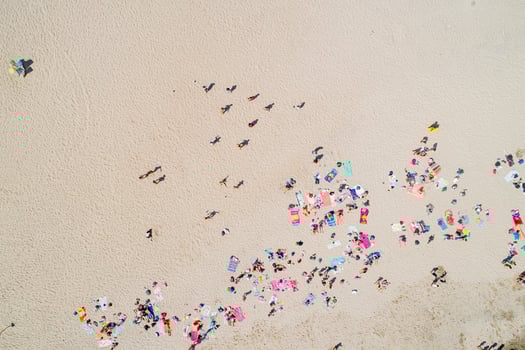 drone zenithal aerial view of a beach with people in summer photo