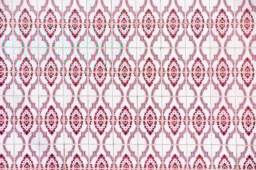close-up view of a wall of red geometric tile shapes photo