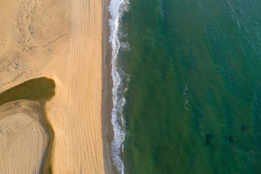 Aerial view of tropical sandy beach and ocean. Copy space photo