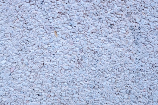 detail of a wall coated with gravel, background textured photo
