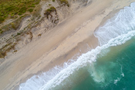 zenithal aerial view of the shore of a beach photo