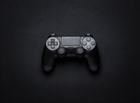 black wireless gamepad on a black background photo