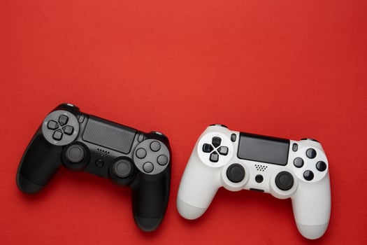 black and white gamepads on a red. Gaming concept photo