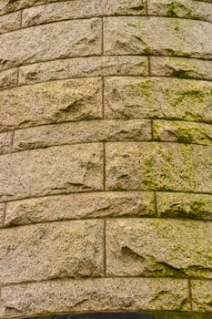 Elemental architectural design of the masonry, on which unicellular green algae grow on the walls at Princeton University. photo