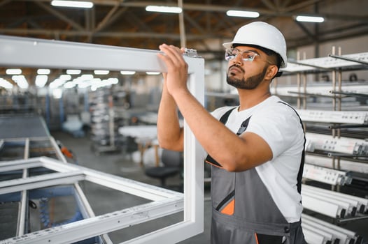 Portrait Indian male staff worker engineer supervisor in safety suit work in factory warehouse photo