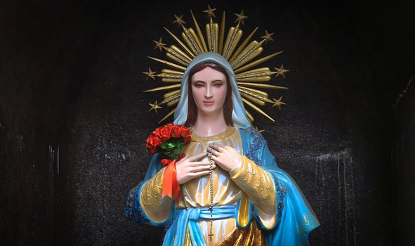 Mother Mary sacred peaceful prayer place, blessed Virgin Mary statue, praying Virgin Mary statue. Religious background on church interior background photo
