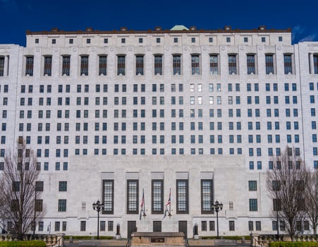 White marble entrance and facade to the Supreme Court of Ohio in Columbus with US flag flying photo