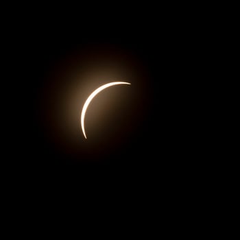 Final stage of the solar eclipse in April 2024 with the moon starting to cover the sun photo