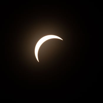 Final stage of the solar eclipse in April 2024 with the moon starting to cover the sun photo