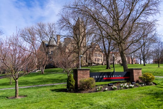 Delaware, Ohio - 8 April 2024 - Sign for college by the historic University Hall at Ohio Wesleyan University in Delaware, OH photo