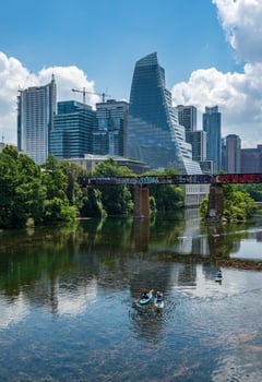 Austin, TX - 15 June 2023. Modern apartment buildings and offices by the Colorado River in cityscape skyline of Austin Texas photo