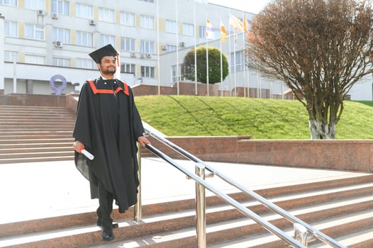 education, graduation and people concept - happy Indian Male graduate student photo