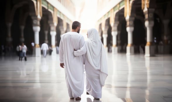 Portrait of a Muslim couple in white Ihram garments at a sacred site, reflecting their devotion and unity during pilgrimage.Generated image photo