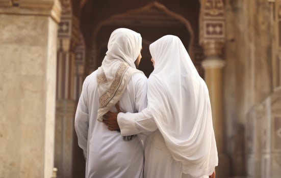 Portrait of a Muslim couple in white Ihram garments at a sacred site, reflecting their devotion and unity during pilgrimage.Generated image photo