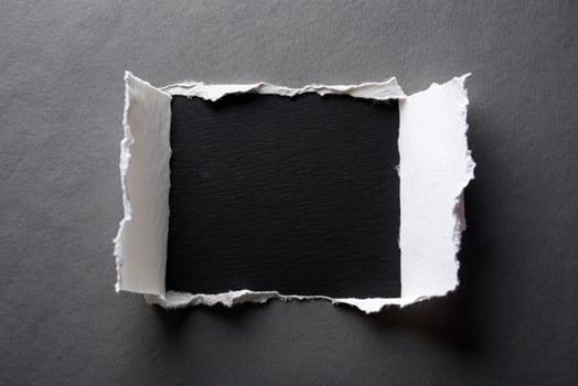 White ripped paper with black background for your background photo