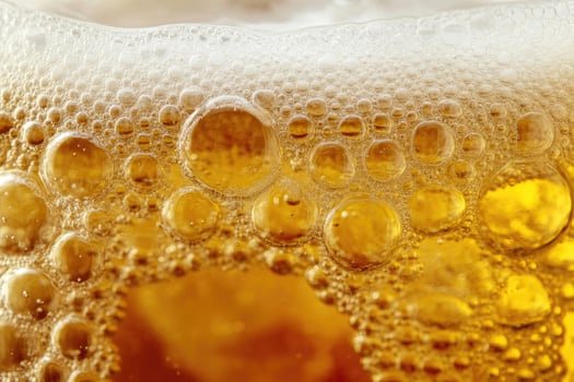 Beer banner with a close-up of beer bubbles and space for text. photo