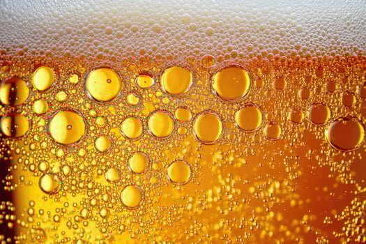 Beer banner with a close-up of beer bubbles and space for text. photo