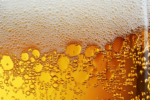 Beer banner with a close-up of beer bubbles and space for text. photo