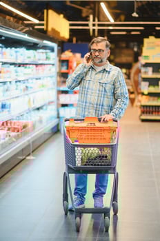Senior man at supermarket store photo