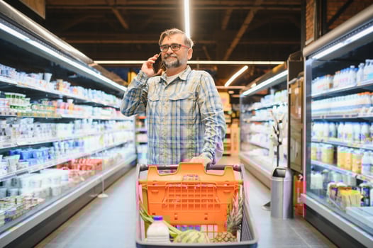 Senior man at supermarket store photo