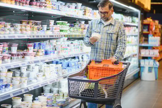 Senior man at supermarket store photo