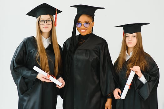 portrait of multiracial graduates holding diploma photo