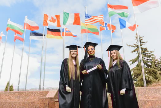 group of multiracial university graduates at graduation ceremony photo