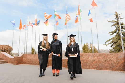 group of multiracial university graduates at graduation ceremony photo