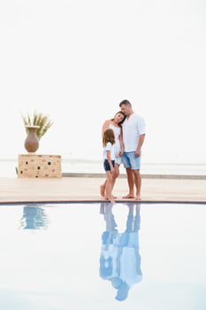 Happy family, summer resting near the pool. father mother and daughter photo