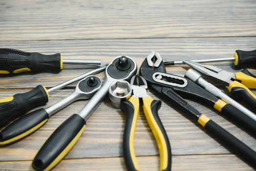 Various tools on wooden background photo