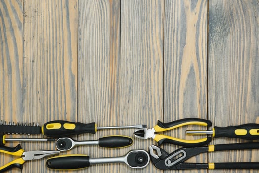 Various tools on wooden background photo
