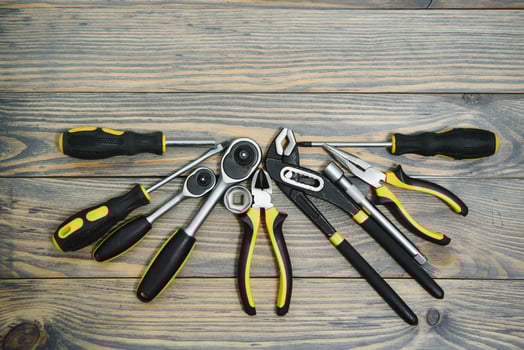 Different tools on a wooden background. photo