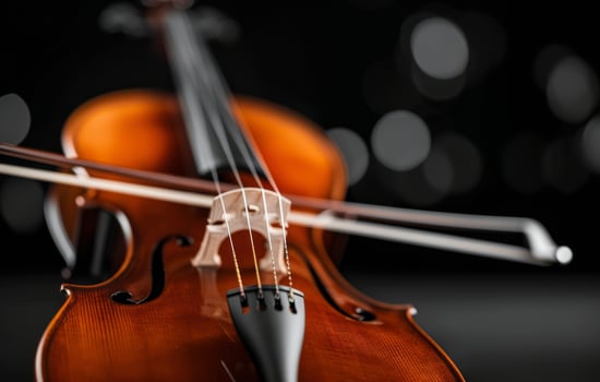 Close-Up of a Vibrant Violin Against a Dark Background photo