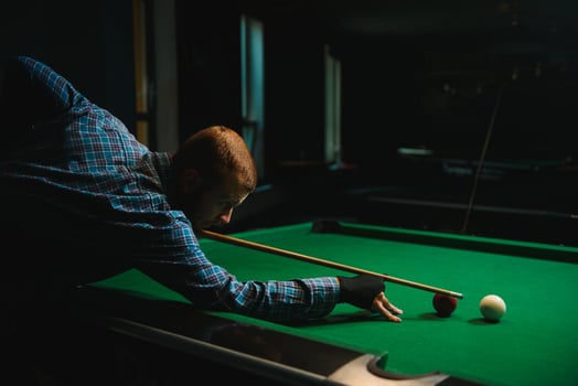Playing billiard - Close-up shot of a man playing billiard photo