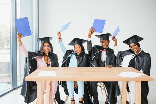 portrait of multiracial graduates holding diploma photo