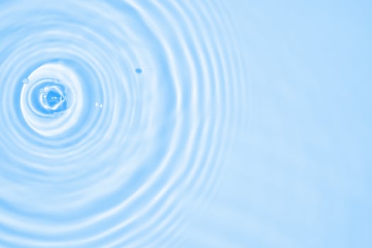 Abstract transparent water shadow surface texture natural ripple on blue background photo
