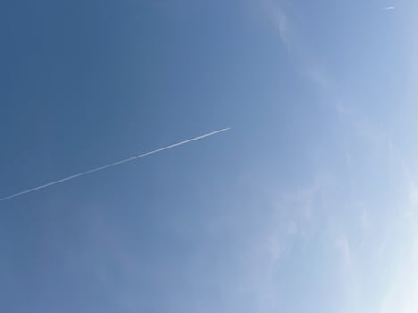 Flight path in the blear blue sky photo