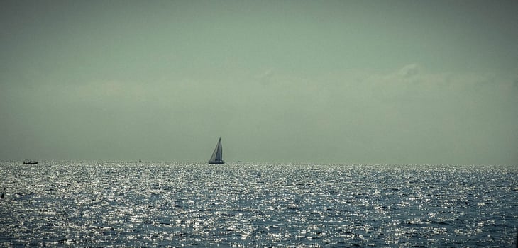 the expanse of blue sea off the coast of italy from a ferry travelling to palermo, sicily for the summer holidays of 2024 photo